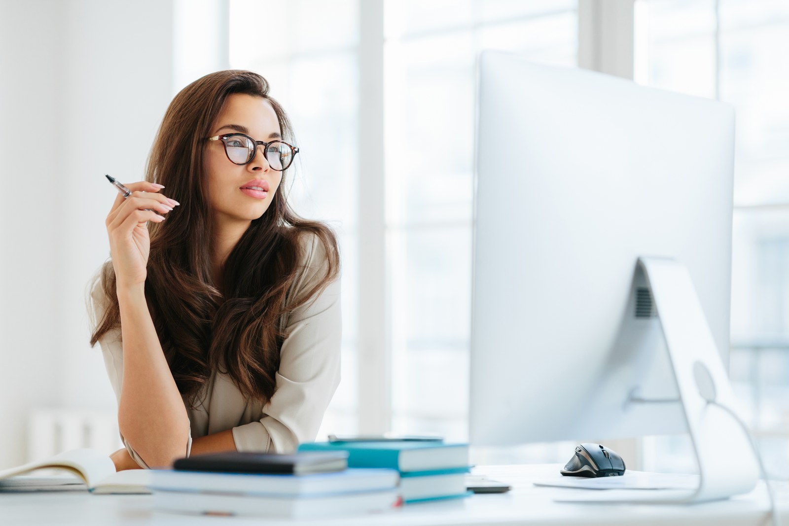 Business owner working at a large screen